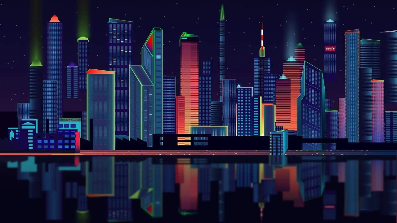 A line of business buildings that are colored blue with orange highlights right next to the water with light coming out the tops.