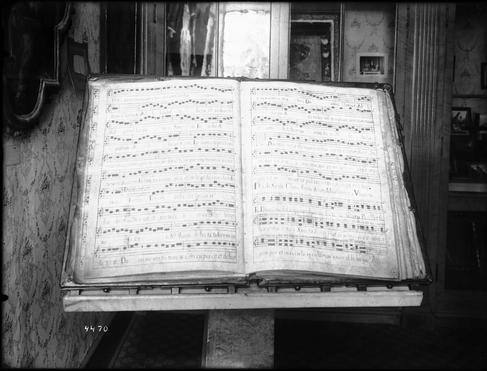 Large open choir book of hymn notation on a stand, a historic look at the worship song lyrics AI tools now evaluate